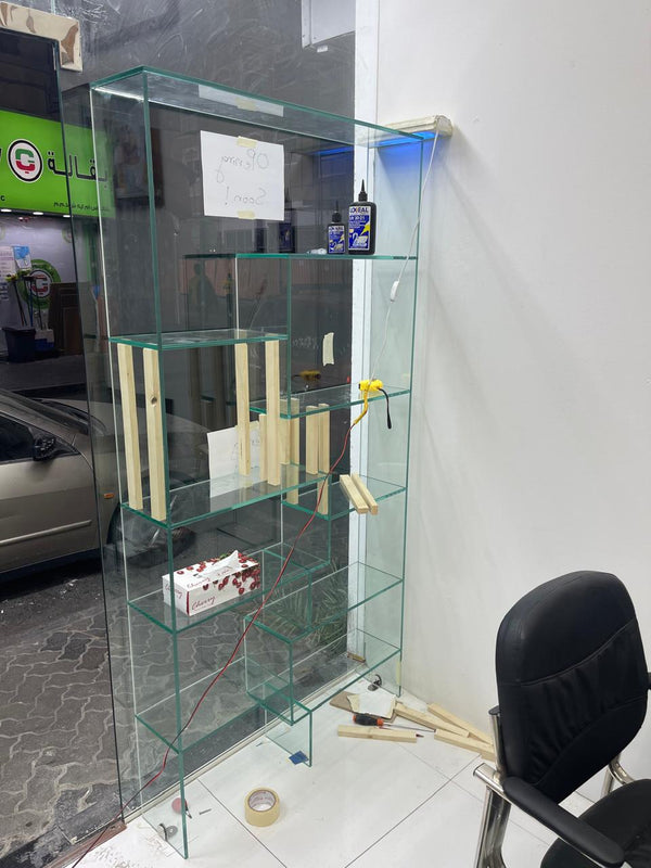 Custom glass showcase installed for retail shop display in Naif Dubai